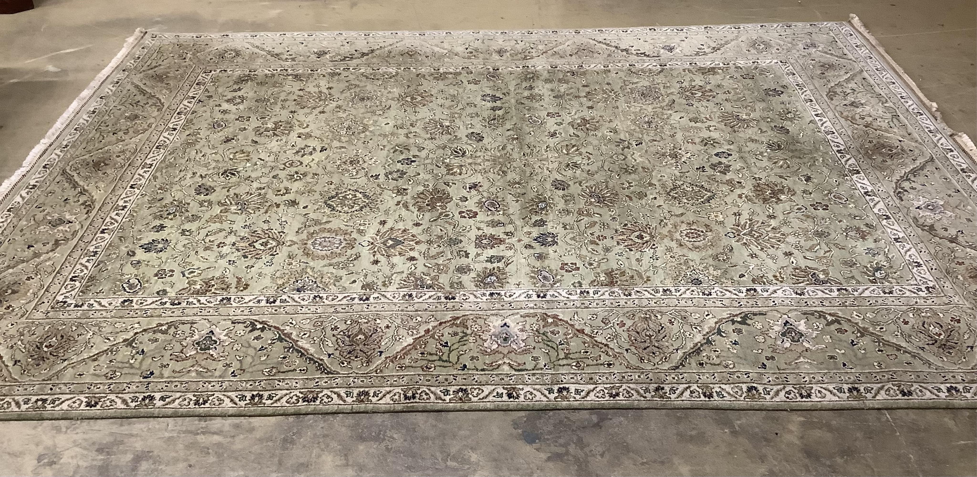 A North West Persian pale green ground carpet, approx. 380 x 280cm. Condition - good